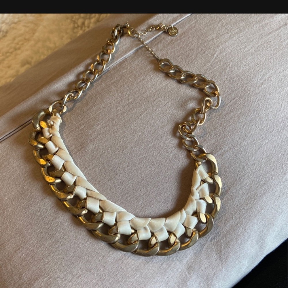 Gold necklace with white ribbon